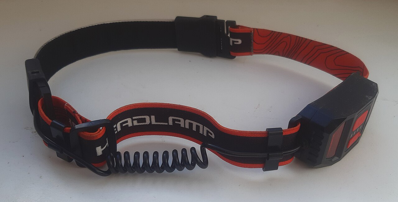 Headlamp with red light mode used for night fishing